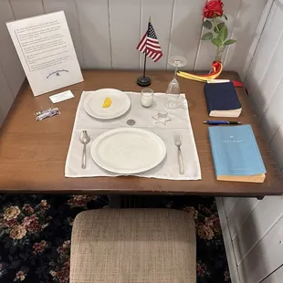 Place setting out of honor.