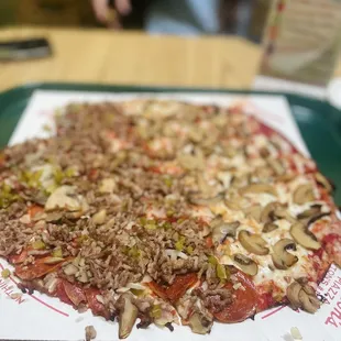 Half Marion's Special Pizza and half Mushroom Pizza