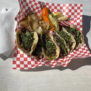 Asada tacos and an asada sope. Always comes with lemons, grilled onions and carrots