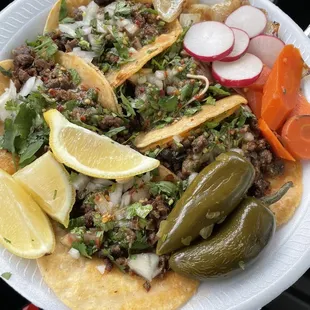 5 carne asada tacos w everything on it  2 jalapeños on the side