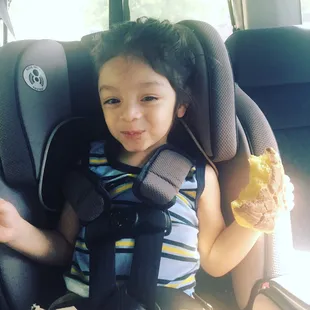 My son enjoying his first concha! Chocolate, he picked it himself:)