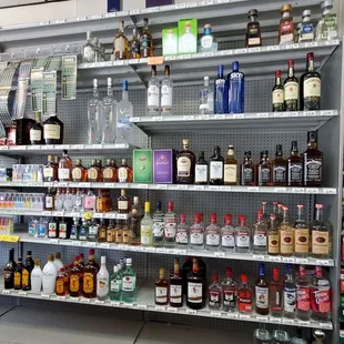 Bottles of discounted Liquor is behind the counter for asking and buying on Friday 8/30/2024.