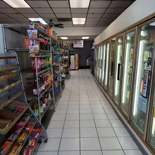 Walking inside for the last time as I shop for clearance items at Mario's Corner Market, local for 15 years. 8/30/2024