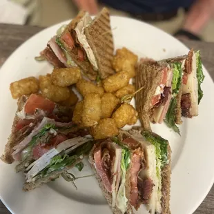 Club sandwich with tater tots.