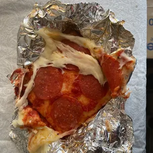 Who wraps  hot pizza in foil??? Next time put it in a box.