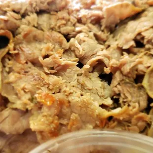 The dry Italian beef, the golden bits make it look like it's cooked on a flat grill almost because it's not dripping in Au Jus.