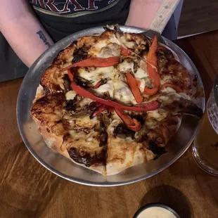 a pizza with peppers and cheese