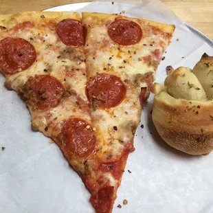 Pepperoni and sausage pizza with a garlic knot!