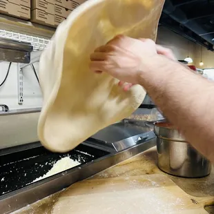 Hand tossed Italian dough at Mario&apos;s pizza in El Mirage