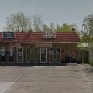 a red truck parked in front of a restaurant