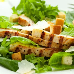 a salad with chicken and lettuce