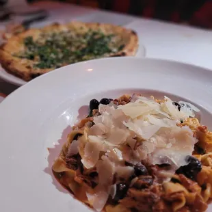 Clam pizza and shredded duck ragu