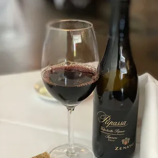 a glass of wine and a cork