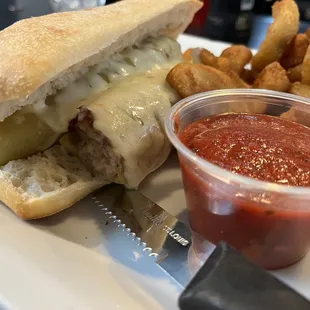 Stuffed hot banana, pepper, sandwich, and french fries