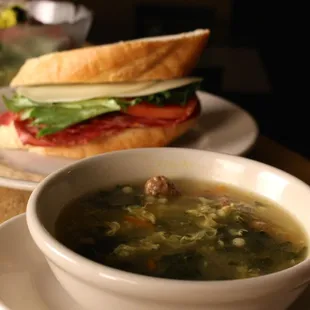 a bowl of soup and a sandwich