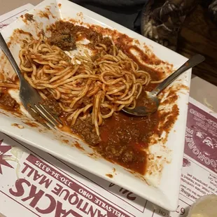 Overcooked spaghetti, bland and tasteless
