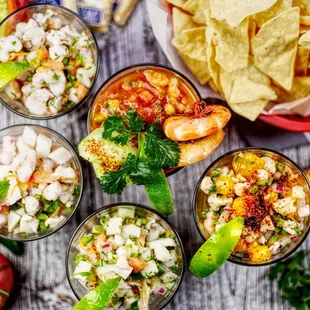 a variety of guacamole and chips