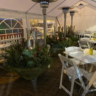 a patio with tables and chairs