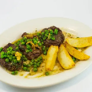 a plate of food with peas and potatoes