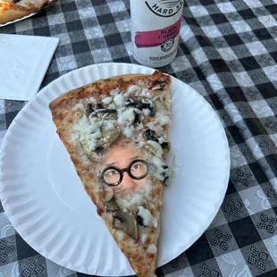 a slice of pizza on a paper plate