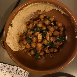 Abuela&apos;s Garbanzos: tomato and bell pepper sauce, Spanish chimichurri, marcona hummus and garlic chips