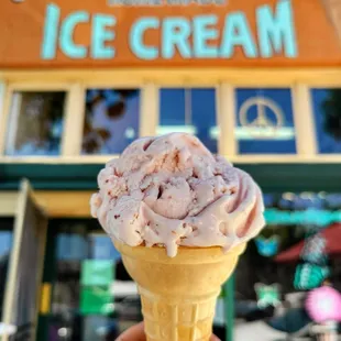 Strawberry ice cream on a cake cone