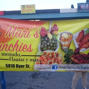 a woman holding a sign