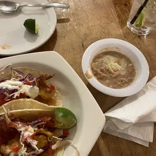 Breaded shrimp tacos and side of beans