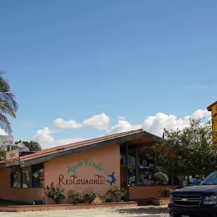 a car parked in front of the restaurant
