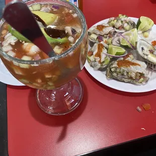 Campechana Cóctel and Oysters topped with Shrimp Ceviche and an aguachile