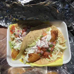 Fish tacos (the sauces they provide are AMAZING)