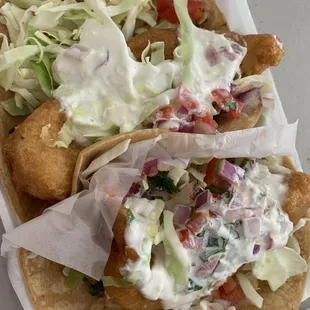 fish tacos with coleslaw and lettuce