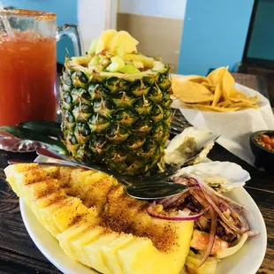a pineapple and a plate of food