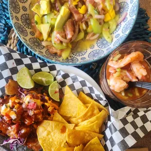 The tuna tostada ceviche I slided onto my dish at home &amp; shrimp coctel I mixed in my own glass, fish taco /chips