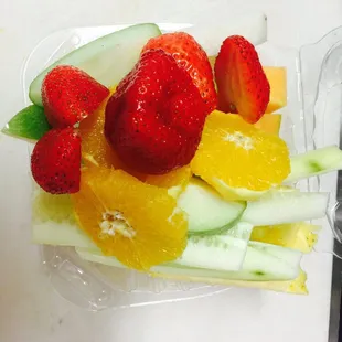 strawberries, oranges, and cucumbers