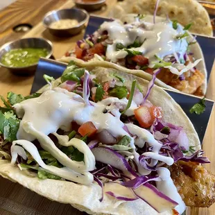 two tacos on a wooden table