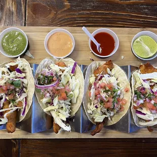 Four fish tacos with choice of sauces