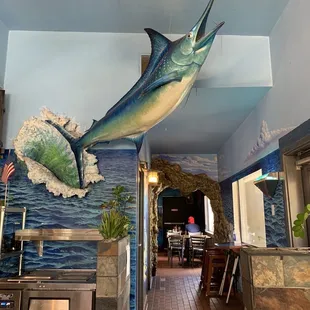 a blue marlin fish hanging from the ceiling