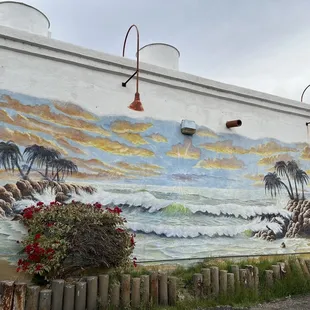 Mural in parking lot side of building