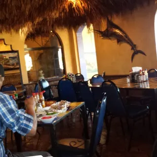 a man sitting at a table in a restaurant