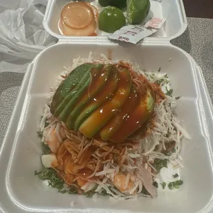Tostada mixta with avocado.