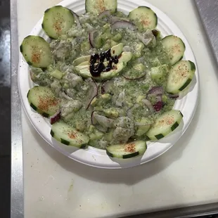 Aguachiles verdes (shrimp cooked with lemon juice and made with a green salsa)