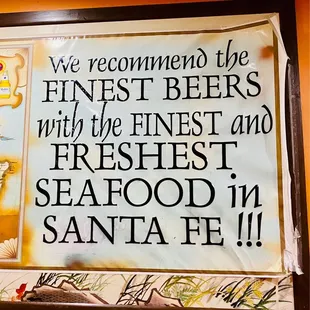 a sign that reads, welcome to the finest beers in the finest and freshest seafood in santa fe