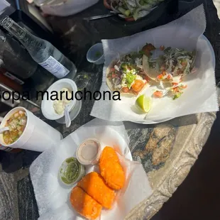 Shrimp tacos, sopa maruchona, empanadas