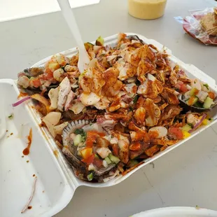 Aguachile mixtos with blood clams and mangoes