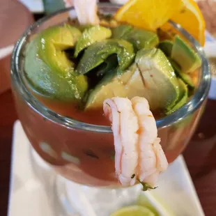 a bowl of shrimp and avocado