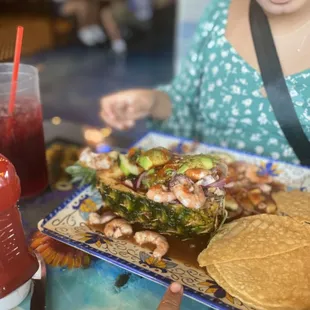 a woman eating a plate of food