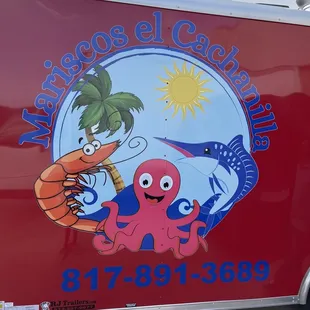 a red food truck with a cartoon character on the side