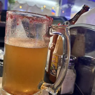 a glass of beer on a table