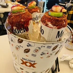 a bucket of bloody hot dogs